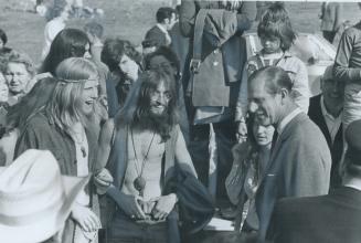 Prince Philip Discusses a 'Bread Shortage', Chatting with two long-haired youths at rodeo in Williams Lake, B