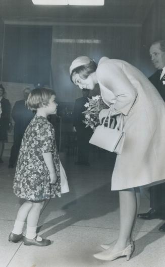 With A Curtsey that would do credit to an old hand in court circles, 5-year-old Penny Medwell presents a bouquet of flowers to Princess Alexandra. Thi(...)