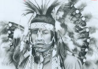 Indian in full regalia was on hand when the Queen visited the Indian village