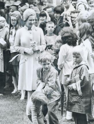 Queen Elizabeth is greeted by children in London's Victoria Park