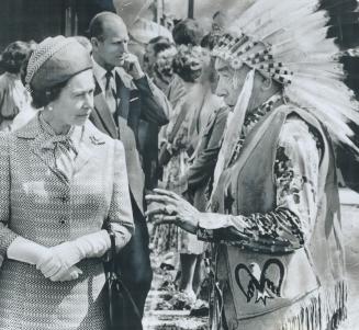 Her majesty meets Chief Helliard McNab at Qu'Appelle, where traditional dances were performed