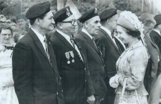 Mark Philips inspects a cross-country racecourse at a farm near Aura, while his mother-in-law, the Queen, chats with war veterans in Deer Lake, Nfld