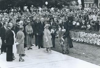 Queen mother meets Mickey Mouse during Canada Day celebrations at Queen's Park