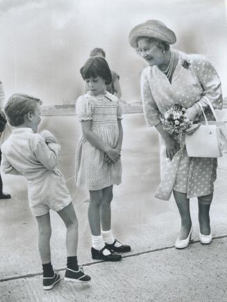 Royalty-shy: Walter Borosa, 4, was just plain overcome at being presented to the Queen Mother when she flew in to Downsview yesterday at the start of her six-day visit to Metro