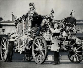 Gilt-carved ceremonial coach, in which King George will drive to open parliament, Oct