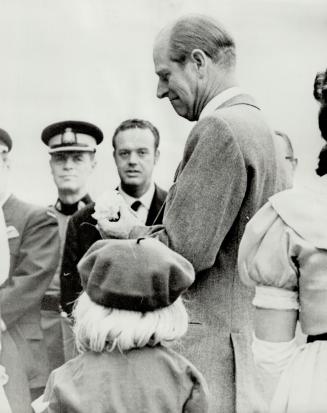 A paper flower presented by a brownie drew a quizzical look from Prince Philip at Fort Steele, B