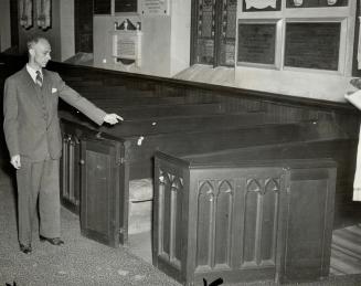 An usher of St. James Episcopal, the Roosevelts' church points out the pew in which their majesties will sit during the special service