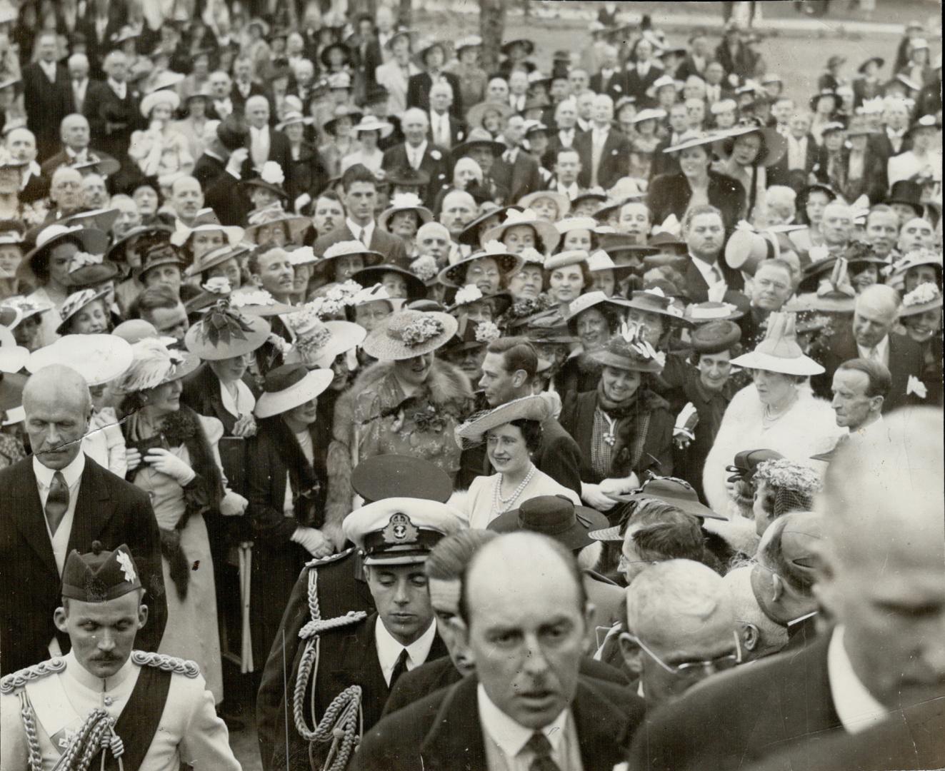 Ottawa Society, eager as any other group of Canadians to get a close-up of the King and Queen, press forward as their majesties emerge from Rideau Hal(...)