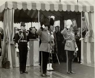 To the left, he wears the full dress uniform of a field marshal