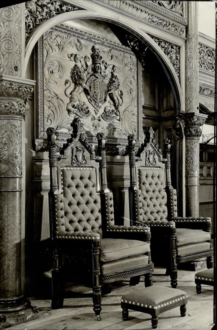 Ready for their Majesties, On a raised dais in the legislative chamber at Queen's Park now stand the two chairs, specially upholstered and decorated f(...)