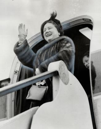 Queen mother Elizabeth is shown waving good-by as she boards her plane for flight to Vancouver