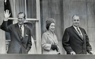 A Princely gesture is made by the Duke of Edinburgh as he and the Queen take in the view from Charlottetown's Provincial House with Premier and Mrs. W(...)