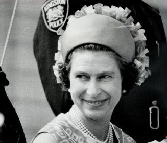 Pillbox hat worn on the back of the head is a favorite with Queen Elizabeth, she must wear hats that reveal her face to the crowds while she is on view to the public