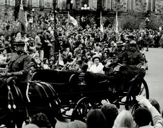 Pageantry: About 5,000 people lined Parliament Hill Tuesday as Queen Elizabeth and Prince Philip arrived in an open landau to open the third session of the 30th Parliament