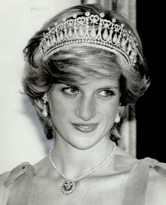 Who's who: The real Diana, Princess of Wales, is on the left in a diamond tiara and necklace greeting Canadian dignitaries in the reception line at Rideau Hall last night