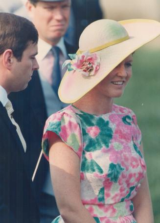 Left, at the Queen's Plate, a matronly-cut Queen Mum floral silk jacquard dress and spray-painted hat