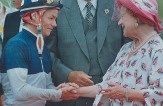 The Queen Mother greets Donald Seymour, winning jockey at the Queen's Plate yesterday