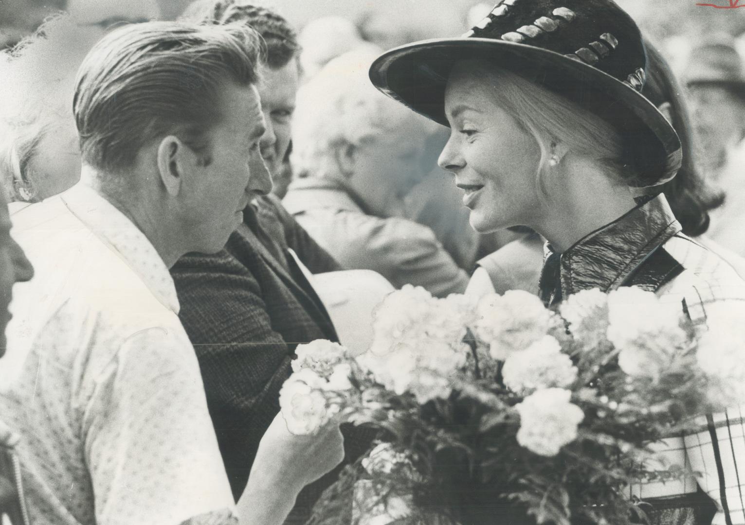 The Duchess of Kent is asked by spectator John Sinclair for a carnation from her bouquet - and hands him one - after she officially launched Metro's U(...)