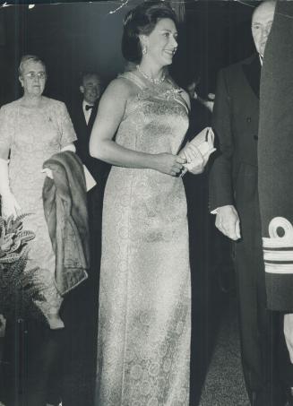 Gown worn by Princess Margaret last night at ball was a gold on gold brocade, with a double-ringed neckline