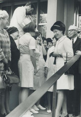 Taking her leave of the hospital named after her, Princess Margaret finds the time to talk with nurses on the steps