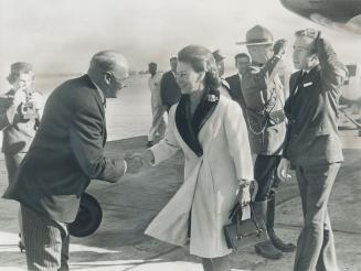 Lower left: Lieutenant-Governor Earl Rowe greets Princess Margaret at Malton airport