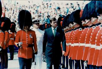Prince Andrew inspects a Guard of Honor provided by the Second Battalion of the Royal 22nd Regiment, at the Old Port of Quebec