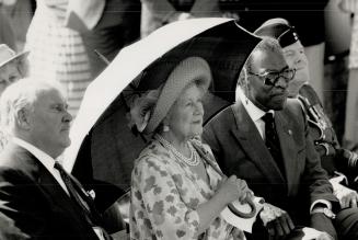 Banting tribute: The Queen Mother shelters from the sun with Lieutenant-Governor Lincoln Alexander at a ceremony honoring Frederick Banting, insulin co-discoverer