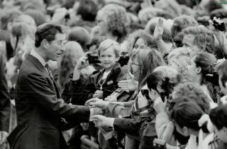 Going walkabout: Prince Charles greets some of the children who waited in Nathan Phillips Square to see him after the official civic welcoming ceremony, presided over by Toronto Mayor Art Eggleton