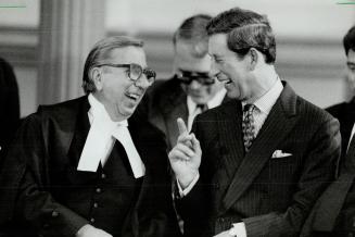Busy day: Prince Charles laughes with Ontario Chief Justice Charles Dubin, left, but misses a smile from Diana at Nathan Phillips Square yesterday