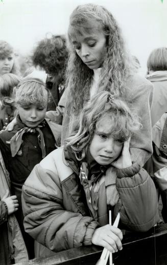 Among friends: Smiling youngsters wave flags, right, and offer flowers to Diana, Princess of Wales, at Science North, above