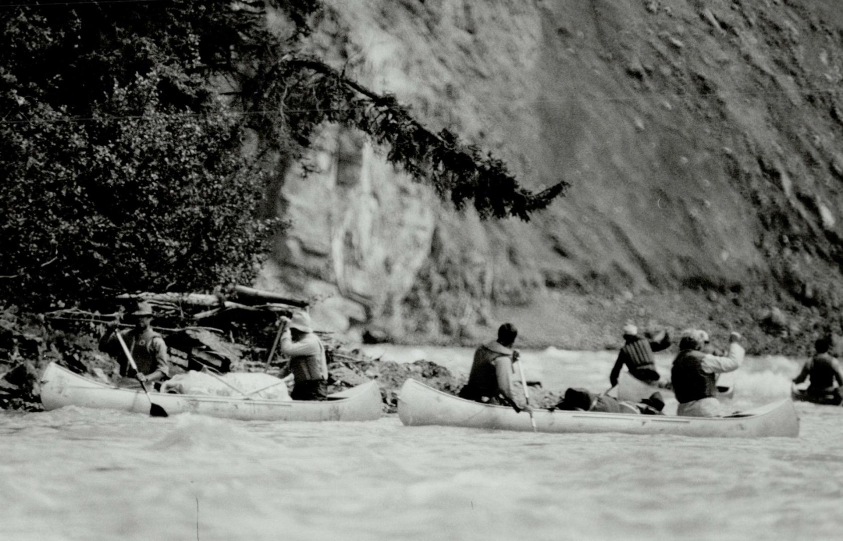 Prince Andrew handles his canoe on the Nahanni River during his wilderness trip