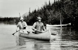 Visitor to Canada: Prince Andrew, right, paddles down Nahanni River, in the Northwest Territories