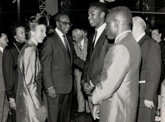 Royal Greeting: Princess Anne, at the side of Ontario Lieutenant-Governor Lincoln Alexander, chats with Canadian Olympic boxers Egerton Marcus, right, and Lennox Lewis