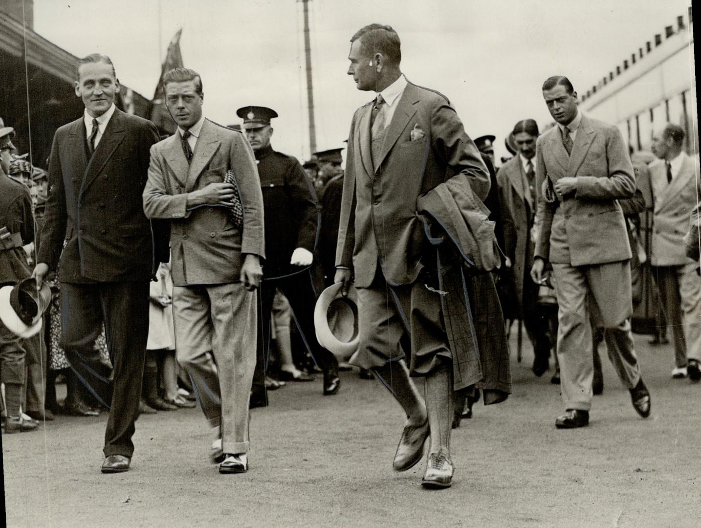 Leaving the railway platform for the golf course, The royal brothers were met by Mayor Reynolds, seen RIGHT of the Prince of Wales, and J. Gill Cardin(...)