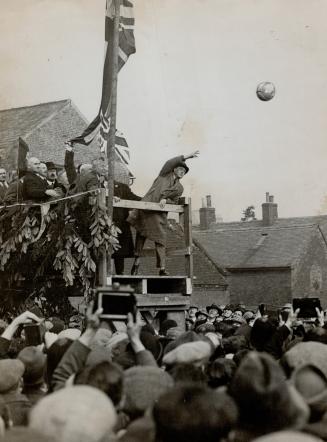 The Prince of Wales throwing out the ball for the start of a football match in Derbyshire