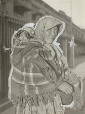 A Stoney Indian' women with her papoose on her back near the Prince of Wales ranch High River, Otta