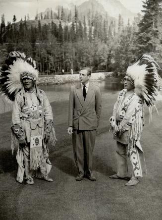 Indians of the Rockies in the persons of old Chief Charlie Bear Paw and Chef Waving Feather, had a friendly meeting with the Duke of Kent. [Incomplete]