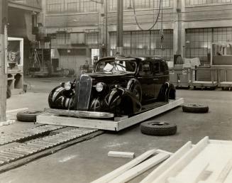 The King's car. Crating for shipment at the Oshawa shipping department
