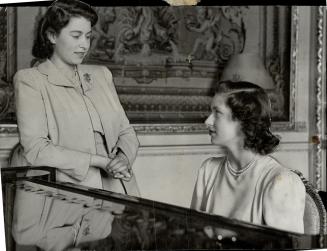 Royal sisters, Princess Elizabeth and Princess Margaret Rose, seated at the piano, were caught in this informative pose in Buckingham Palace recently. [Incomplete]