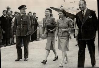 Princess Margaret is met by her betrothed sister, Princess Elizabeth, at London airport after the former had flown back from Northern Ireland launching of the new liner Edinburgh Castle