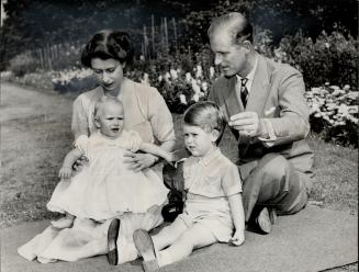Old trick is employed by the Royal father as he snaps his fingers to draw