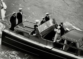 Queen and Prince Philip on river Thames during river pageant in London