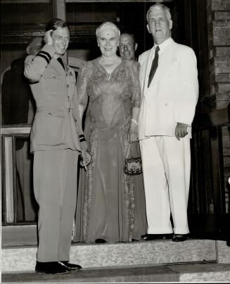 Left to Right H. R. H. Duke of Kent Mrs McWilliams Hon R. F. McWilliams Lt Gov. of Manitoba at the entrance to government House winnipeg as the Duke r(...)