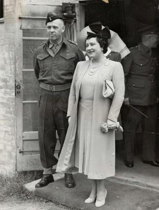 Her majesty the Queen is shown leaving a Canadian hospital in England after visiting Canadians wounded in the invasion of France. [Incomplete]