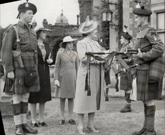 The Queen stops for a moment to chat with Lance-Corporal Malcolm Weir of Toronto