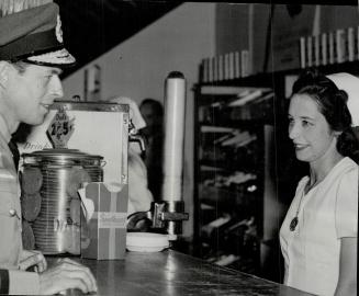 In the Y.M.C.A Canteen at Manning Pool, the Duke of Kent chats with Mrs. J. H. Domine. [Incomplete]