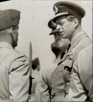 Centre, the duke inspects, at close hand, the guard of honor which turned out for the occasion