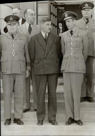 At St. Thomas, Group Captain Collis, C.O. of the Commonwealth Air Training Plan technical training school in St. Thomas, where 6,000 men are training,(...)