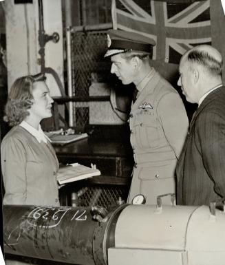 The Duke also visited the Westinghouse Electric plant at Hamilton and there he stopped a moment to chat with this young lady, who seems a little scare(...)