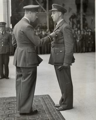 His Majesty the King recently decorated a number of Canadian airmen while visiting the R